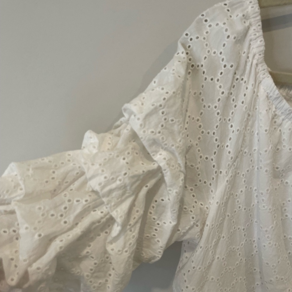 White off the shoulder eyelet top.